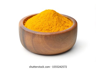 Finely ground dry Turmeric (Curcuma longa Linn) powder in wooden bowl isolated on white background. Clipping path.
