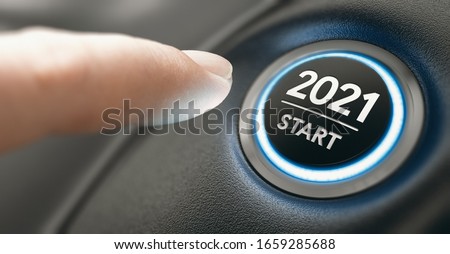 Finger about to press a car ignition button with the text 2021 start. Year two thousand and twenty one concept. Composite image between a hand photography and a 3D background.