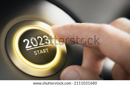 Finger about to press a car ignition button with the text 2023 start. Year two thousand and twenty three concept. Composite image between a hand photography and a 3D background.