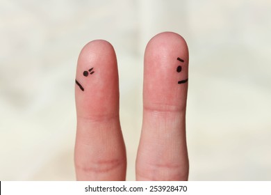Finger art of couple. Couple after an argument looking in different directions.
