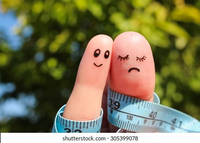 Finger art of couple with meter. The concept man is thin, woman is fat. 