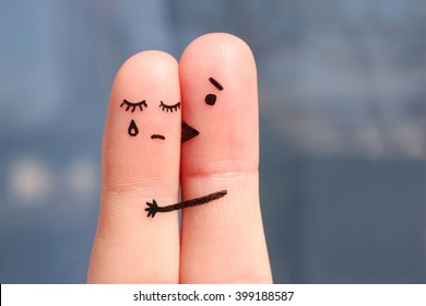 Finger art of displeased couple. Woman cries, man reassures her. He kisses and hugs.