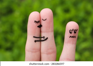 Finger art of Happy coupl kissing and hugging. girl is jealous and angry.