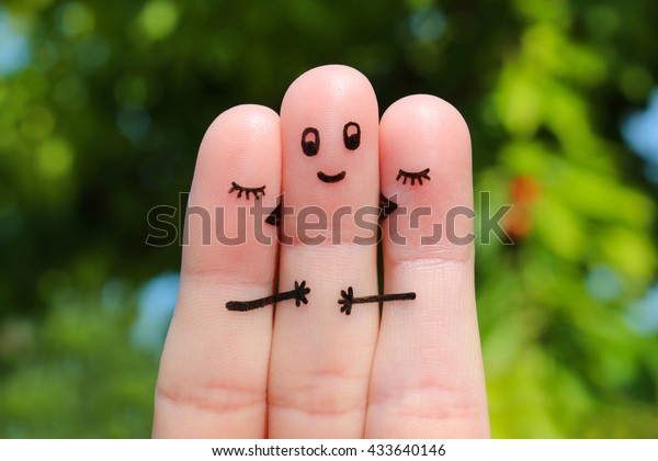 Finger art. Two women\
kissing a man.