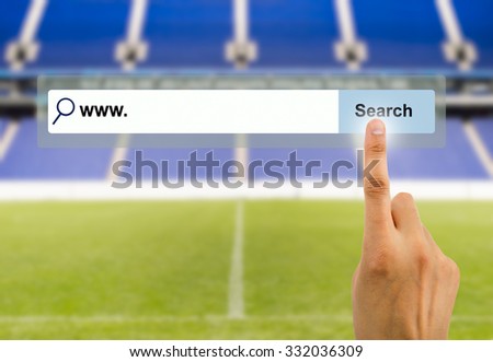 Finger clicking a search button with stadium background 