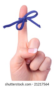 A finger contains a bow-tied string as a reminder to perform a specific task