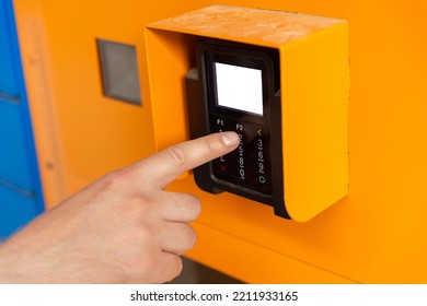 Finger Dials Pin Code On Terminal. Transaction Pay And Shopping Concept. Close Up Of Male Hand Entering Personal Identification Number At An ATM Machine Or At Postal Locker.