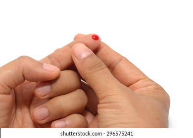 Finger with drop of fresh blood