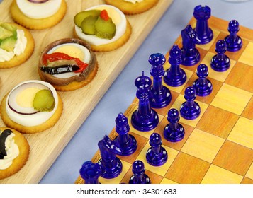 Finger Food Laid Out With A Game Of Chess For A Games Night.