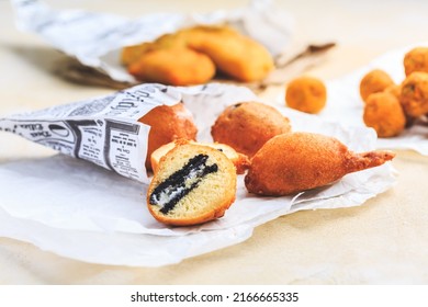 Finger food and street food - fried curd balls filled with Oreo cookies