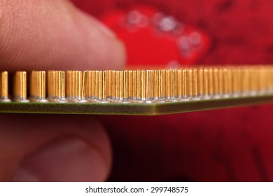 finger holding central processing unit, extra close up