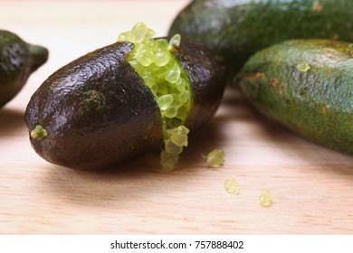 Finger Limes Or Caviar Limes On Wooden Chop. Fruits For Decorate Dish.