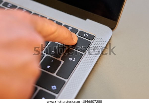 Finger on\
backspace key delete key of notebook\
laptop