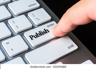 Finger on computer keyboard keys with Publish word - Shutterstock ID 533195683