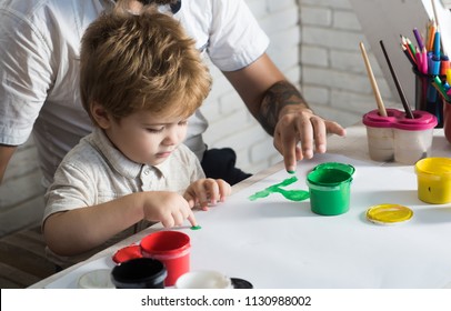 Finger Paint. Tools For Children's Creativity. Child Draws With Father. Creativity For Children. Art Therapy. The Drawing Teacher Works With A Small Talented Boy. Development Of Children