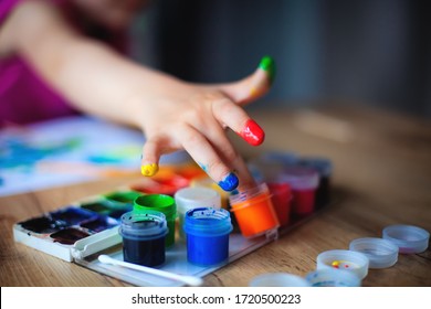 Finger Painting. Close-up. Fingers Of Children's Hands In Bright Paint. Early Development. Hobby