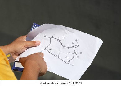 finger pointing to a map