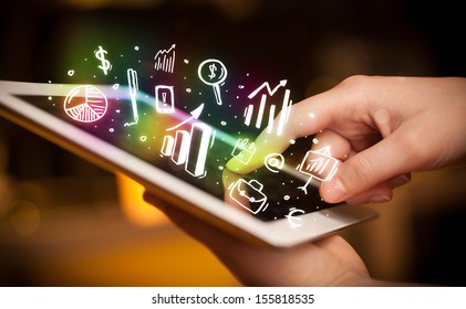 Finger pointing on tablet pc, charts concept