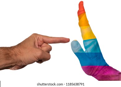 Finger pointing to a peaceful hand with pride flag isolated on a white background. Intolerance against gay community and discrimination concept.