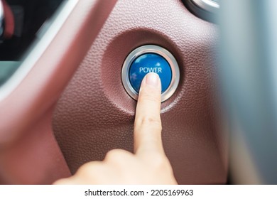 Finger Press A Car Ignition Button Or START Engine Inside Modern Electric Automobile. Keyless, Change, Strategy, Vision, Innovation And Future Concept