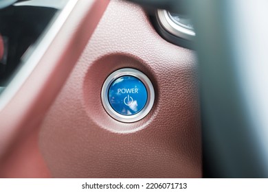 Finger Press A Car Ignition Button Or START Engine Inside Modern Electric Automobile. Keyless, Change, Strategy, Vision, Innovation And Future Concept