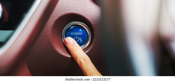 Finger Press A Car Ignition Button Or START Engine Inside Modern Electric Automobile. Keyless, Change, Strategy, Vision, Innovation And Future Concept