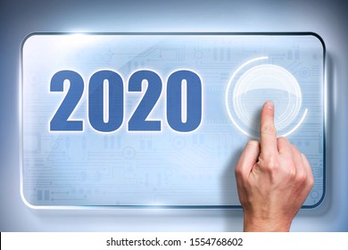 finger presses a button with a loading bar on a touchscreen to load up 2020