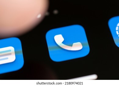 finger presses the call icon on the black screen of the smartphone. - Shutterstock ID 2180974021