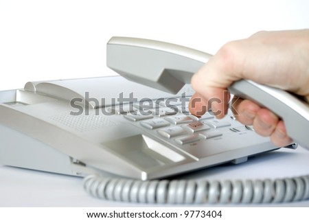 Finger presses figure on phone