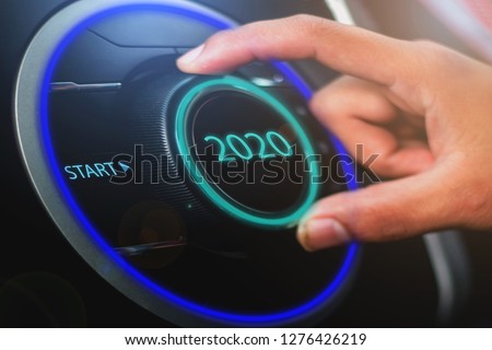 Finger pressing a 2020 start button. Concept of new year, two thousand twenty. Composite between a photography and a 3D background - Image 