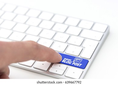 finger pressing a blue key labeled NEW BLOG POST with text balloon bubble symbol on a computer keyboard concept 