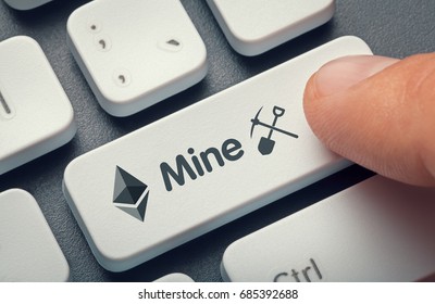 Finger Pressing Computer Key With Ethereum Symbol, Mine Word And Symbol. Crypto Mining Concept. Cryptocurrency Background.