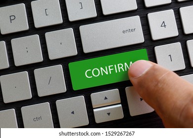 Finger pressing confirm button keypad on laptop computer. Business and finance concept. - Shutterstock ID 1529267267