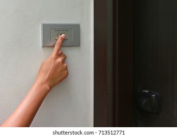 Finger Pressing Doorbell Hotel. Close Up Of Hand Ringing Doorbell.