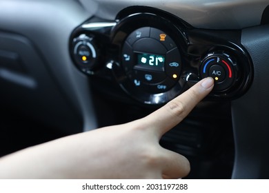 Finger Pressing On Power Button On Off Switch Of A Car Air Conditioning And Heating System To Turn On The Fan Of The AC Inside The Car