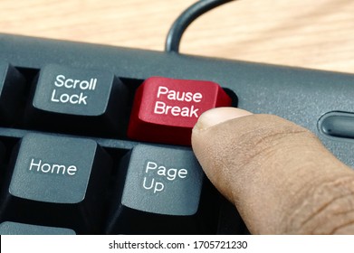 Finger Pressing Red Pause And Break Keyboard Button With Noise And Grain Effect.selective Focus.