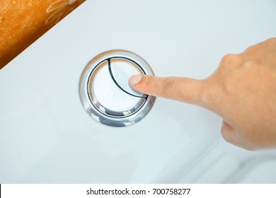 finger push button flush for cleaning - Shutterstock ID 700758277