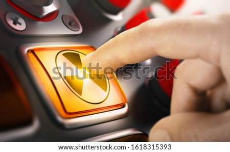 Finger pushing a nuclear button. Concept of uranium enrichment and radioactivity. Composite image between a hand photography and a 3D background.