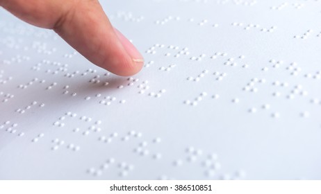 Finger Read Braille Alphabet In White Paper.