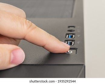 Finger Is Ready To Press Down The On Off Button On The Personal Computer System Unit. Power Button On The Top Of Desktop PC Tower Case. Hardware Equipment Concept. Close-up.