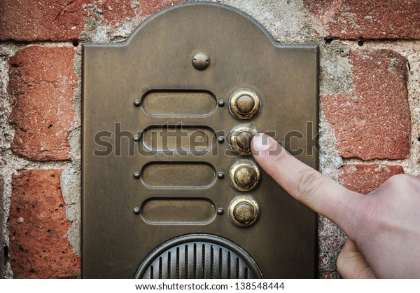 finger ringing a door\
bell