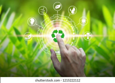 Finger touch with environment Icons over the Network connection on nature background, Technology ecology concept. - Shutterstock ID 1215222112