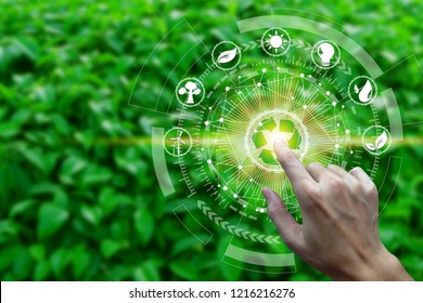 Finger touch with environment Icons over the Network connection on nature background, Technology ecology concept. - Shutterstock ID 1216216276