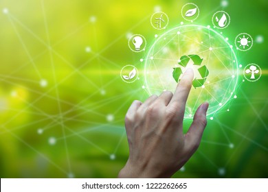 Finger touch with environment Icons over the Network connection on nature background, Technology ecology concept. - Shutterstock ID 1222262665