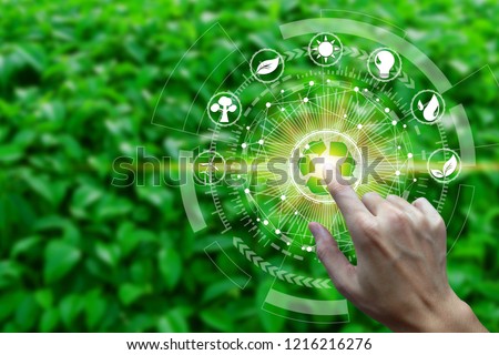 Finger touch with environment Icons over the Network connection on nature background, Technology ecology concept.