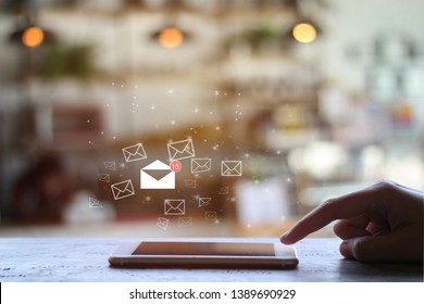 finger touch mobile check e-mail on coffee shop background with copy space. Communication concept. Double exposure - Shutterstock ID 1389690929