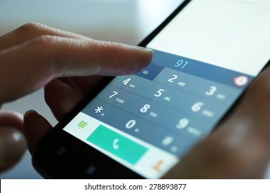 Finger Touch Number On Smartphone To Make A Call, Close Up