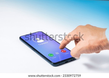 Finger is touching decline button for incoming call from creditor on smartphone screen. Financial or debt concept.