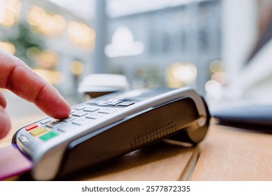 Finger touching payment terminal, processing credit card transaction