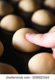 Finger Touching Proofing Bread Dough.